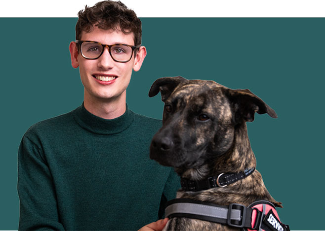 Portrait of a young man with Friedreich ataxia and his dog.